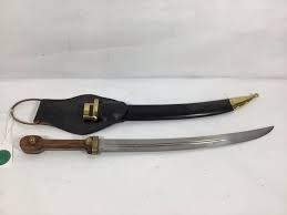 Sold at Auction: CURVED BLADE SWORD WITH WOODEN HANDLE