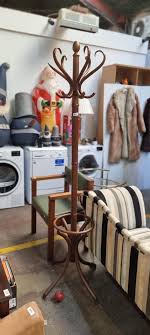 A fabulous vintage bentwood free standing coat hanger with 12 hooks and umbrella stand. Some damage