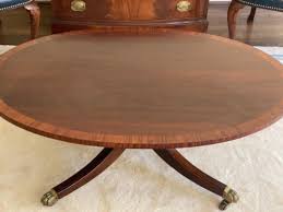 Baker Oval Mahogany Coffee Table with Hairy Claw Feet and Inlaid banding | EstateSales.org