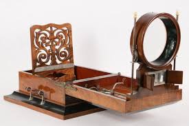 Lot - 19TH C GLASS SLIDE & STEREOVIEWER - Scarce Victorian Rosewood and Black Lacquer Table Top Large Stereoscope and Cabinet Card Photo Viewer, circa 1870, probably British, having an integral adjustable