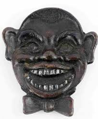 Sold at Auction: BLACK AMERICANA CAST IRON SMILING FACE TRAY