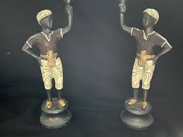 Two antique (Art Deco) bronze blackamoor candleholders, cold ...