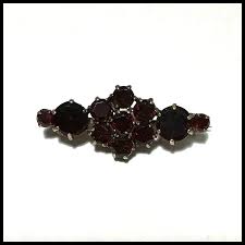 Edwardian Faux Garnet Table Cut Rhinestone Brooch. For Sale at Ruby Lane