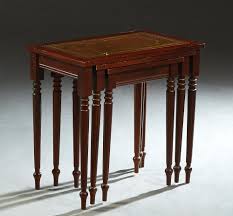 Sold at Auction: Nest of Three French Louis XVI Style Carved Beech Tables, 20th c., the gilt tooled leather inset tops on turned tapered reeded legs,...