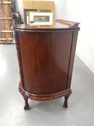 Sold at Auction: MAHOGANY VANITY WITH BALL AND CLAW FEET. CARVED TRIM. KIDNEY SHAPED.
