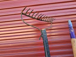 Large Barrel of Mixed Farm Tools and handles | EstateSales.org