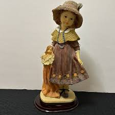 Accents | Vintage Alabaster Girl With Doll On Wooden Stand ...