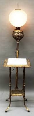 Sold at Auction: Antique Brass Swing Arm Floor Lamp