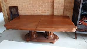 Can the cross piece be removed from the dining table base?