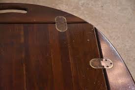 Ethan Allen cherry butler's tray style coffee table with "x" stretcher base; 28-2186 - R.H. Lee & Co. Auctioneers