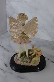 Vintage Resin Angel/Fairy Holding Flowers | eBay