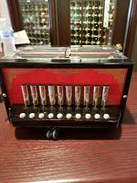 Small German Pipe Accordion 11" Wide X 10.5" Long - Beck Auctions Inc.