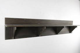 A Fireplace Mantel Having A Shelf Supported By A