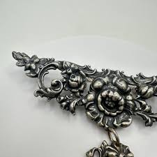 Art Nouveau antique sterling silver repoussé floral hanging brooch pin