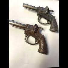 Sold at Auction: Two Echo Toy Cap Guns