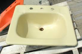 Yellow bathroom sink, cast iron drop-in style, original ...