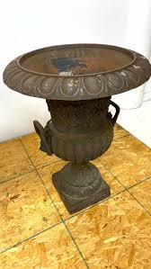 Sold at Auction: PAIR CAST IRON OUTDOOR GARDEN URN PLANTERS WITH LION HE