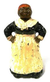 Lot - Hubley "Aunt Jemima" doorstop, cast iron, catalogue no. 337, full figure with hands on hips, marked on interior, red handkerchief an...