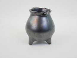 Charming pitcher on three feet in mat black ceramic For Sale ...