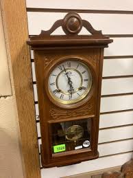 Lot - The TIME mfg. co. wall hanging clock.