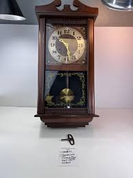 Centerium Pendulum wooden wall clock | EstateSales.org