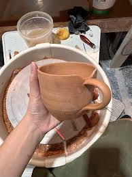This was one day after attaching the handles. They are greenware - is it possible/worth repairing and attaching new handles? Why did they break off like that? : r/Pottery