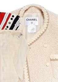 A CREAM WOOL-BLEND COAT AND TWO FOULARDS, CHANEL | A ...