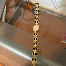 vintage gold watch with black accents. just... | Depop
