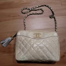 CHANEL | Bags | Chanellizard Quilted Tassel Purse Case Beige ...