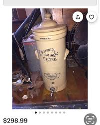 Antique, complete Cheavin's Saludor water filter/dispenser. We have added a brass vintage tap and created a solid beechwood block for it to stand on. H: 50cm plus 10.5cm for beechwood block. Diameter