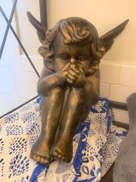 Angel statue bathroom decor found at Goodwill in Maryland