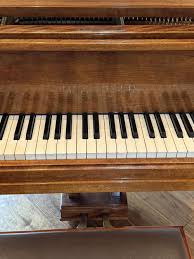 Sold at Auction: A 1935 Bluthner baby grand piano,