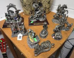 Collection of pewter dragon and wizard figures by J. Ascough