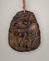 Sold at Auction: A 'JADE IMITATION' GLASS PENDANT WITH ...