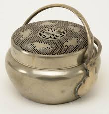 Lot - Bronze Hand Warmer, China, 19/20th century, with openwork lid and swivel handle. Depth 8 in.