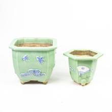 Sold at Auction: (lot of 2) Chinese molded celadon glazed planters