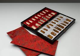 Sold at Auction: An early to mid 20th century Chinese carved bone chess set with timber board (H:8cm - tallest piece) (W:40.5cm x W:40.5cm - board)