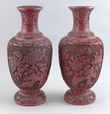 Lot - PAIR OF CHINESE CARVED CINNABAR BALUSTER VASES Early 20th Century Heights 16”.