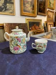 A Chinese Canton famille rose eight-part tea set with birds and butterflies among blossoming branches, ca. 1900 - Coronari Auctions