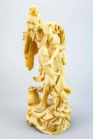 Sold at Auction: Carved Faux Bone Figure of Chinese Fisherman