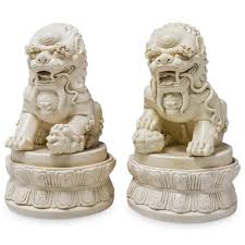 Sold at Auction: Pair Of Chinese Porcelain Blanc De Chine Guardian Lions