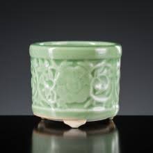 Sold at Auction: A LONGQUAN CELADON-GLAZED 'FLORAL' TRIPOD ...