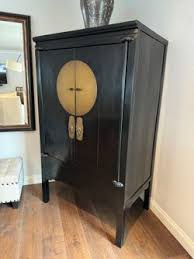 Antique Black Lacquer Wedding Cabinet with Oversized Brass Medallion for Sale in Long Beach, CA - OfferUp