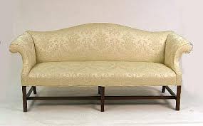 Lot - A GEORGIAN-STYLE MAHOGANY CAMELBACK SOFA