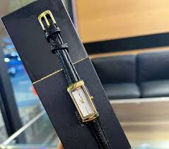 Female fashion quartz watch with round dial and luxury brand ...