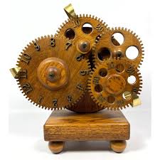 Sold at Auction: CLOCKWORK INC. OAK WOODEN GEAR CLOCK. SERIAL #2534. LABEL.