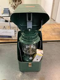 Sold at Auction: Coleman Lantern in Metal Case