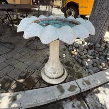 Concrete flower shaped outdoor Bird Bath | EstateSales.org