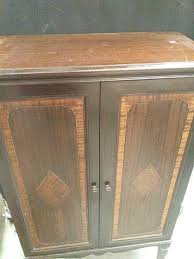 Sold at Auction: Antique Wooden Player Piano Scroll Storage Cabinet