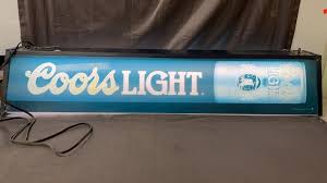 Sold at Auction: Powered on 10x49 inch Coors Light Beer metal light